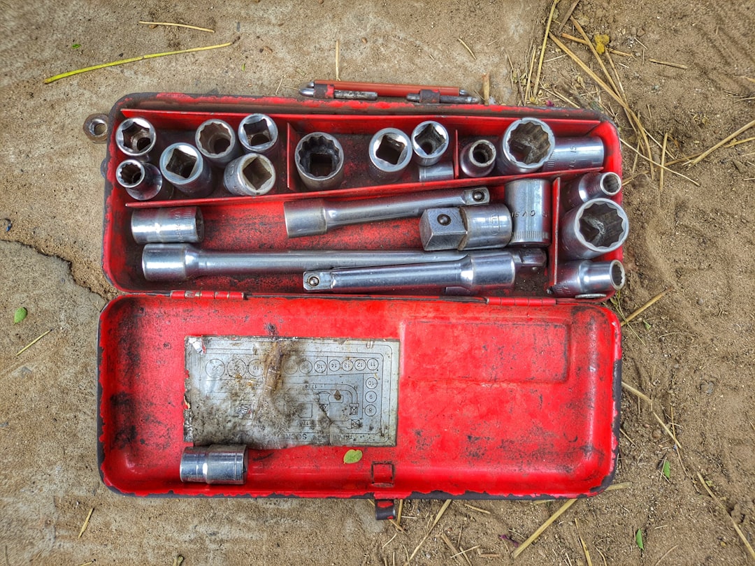 Photo by Stavan Macwan a red box with a couple of guns in it